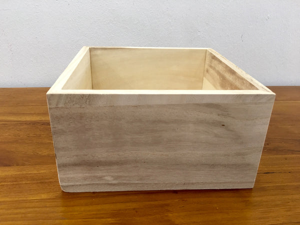 Small light wooden square crate