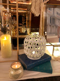 Small white lanterns with LED candles