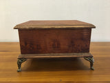 Wooden box with gold legs