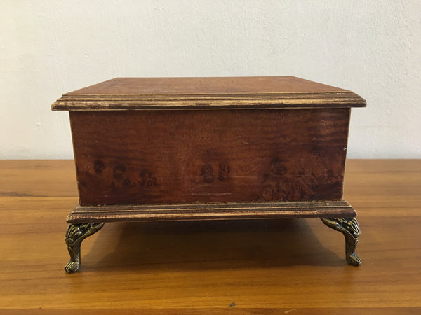 Wooden box with gold legs