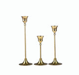 Gold vintage candle stands with white candles